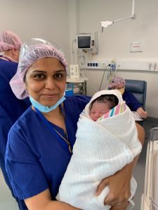 Dr. Samina Ahmed Holding Newborn – Expert Obstetric Care